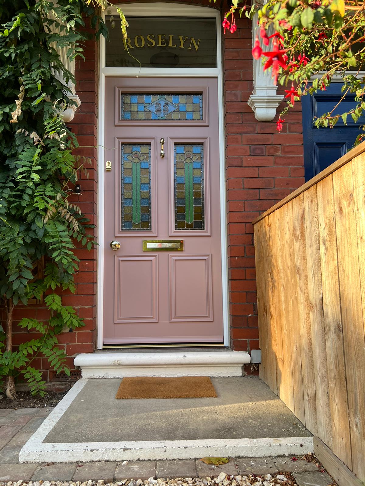 Our Hampton door on a period property. Pink in colour with intricate coloured lead detailing.